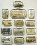 Thirteen glass souvenir paperweights