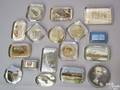 Seventeen glass souvenir paperweights