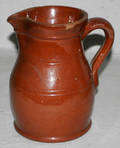 0509 BROWN POTTERY PITCHER H 8 DIA 6