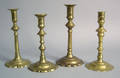 Four Queen Anne brass candlesticks 18th c
