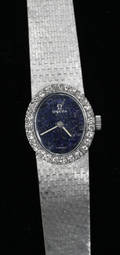 22042 LADYS OMEGA WATCH WITH A DIAMOND BEZEL