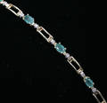 012042 14KT YELLOW GOLD TENNIS BRACELET  10 EMERALDS