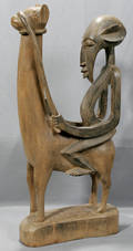 010030 DOGON WOODEN FIGURE ON HORSE H 33 W 17