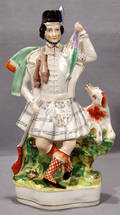 0007 ENGLISH STAFFORDSHIRE POTTERY FIGURE OF A SCOTSMA