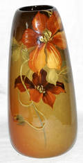 061146 WELLER POTTERY VASE W RED FLOWERS