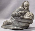 052125 INUIT SOAPSTONE CARVING ESKIMO HOLDING WALRUS