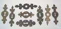 Eight wrought iron cutout escutcheons 18th19th c