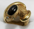 062221 GOLD SERPENT FORM RING W GARNET