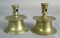 Two Spanish brass capstan candlesticks 16th c