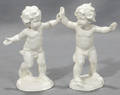 040370 PORCELAIN FIGURES OF PUTTI W RAISED ARMS