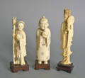Three carved ivory figures