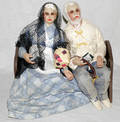 071460 POURED WAX DOLLS COUPLE ON A BENCH