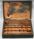 060377 ROSEWOOD BOX OF ALPHABET RUBBER STAMPS