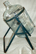 070500 PANELED GLASS WATER JUG W IRON STAND