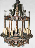 071012 IRON CHANDELIER W THEATRE MASK MOTIFS
