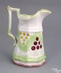 Green and red spatter paneled pitcher