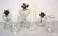 Three clear glass oil lamps