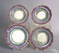 Four red blue and green rainbow spatter scalloped rim plates