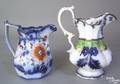 Two ovoid paneled Gaudy ironstone pitchers