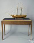 Carved model of a 2masted tall ship