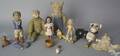 Group of carved and composition toy figures