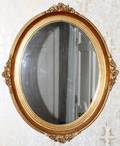 CARVED GILT WOOD OVAL WALL MIRROR 20TH C