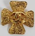 CHANEL GOLD TONE LOGO BROOCH