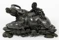 SOOCHOW JADE CHILD SITTING ON OX WTEAK CARVED BASE