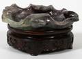 CHINESE CARVED AMETHYST LEAF ON CARVED WOOD BASE