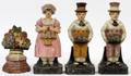 CAST IRON FIGURAL  FLOWER BASKET DOORSTOPS FOUR