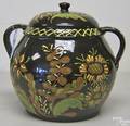 Large Breininger Pottery slip and sgraffito decorated redware covered jar with floral and vine decoration