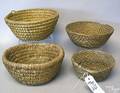 Four rye straw baskets