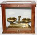 BRASS DOUBLEPAN SCALE IN AN OAK CASE