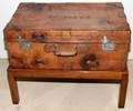 ENGLISH LEATHER VINTAGE SUITCASE ON AN OAK STAND