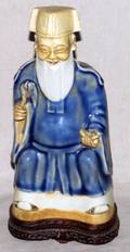 CHINESE PORCELAIN SEATED FIGURE OF SCHOLAR