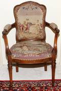 FRENCH LOUIS XVI STYLE CARVED WALNUT ARMCHAIR