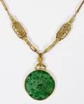 14KT YELLOW GOLD  CARVED JADE DISC PENDANT