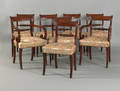 Set of 8 classical style mahogany saber leg dining chairs late 19th c