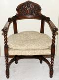 JACOBEAN STYLE CARVED WALNUT ARMCHAIR