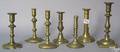 Seven brass candlesticks