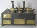 Tin and brass toy stove