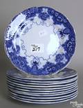 Twelve matching flow blue plates
