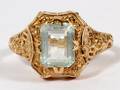 GOLD AND EMERALD CUT LIGHT TOPAZ RING