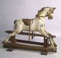 Swallow Toys carved and painted rocking horse early 20th c