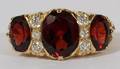LADYS 18KT YELLOW GOLD DIAMOND AND GARNET RING