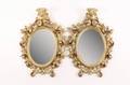 Pair of Small Oval Giltwood Mirrors