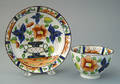 Gaudy Dutch urn cup and saucer