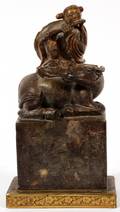 CHINESE CARVED BROWN SOAPSTONE FIGURE ON BUFFALO