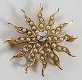 14 KT GOLD AND DIAMOND BROOCH W30 CT CENTER