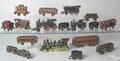 Assorted group of cast iron train engines passenger cars and freight cars